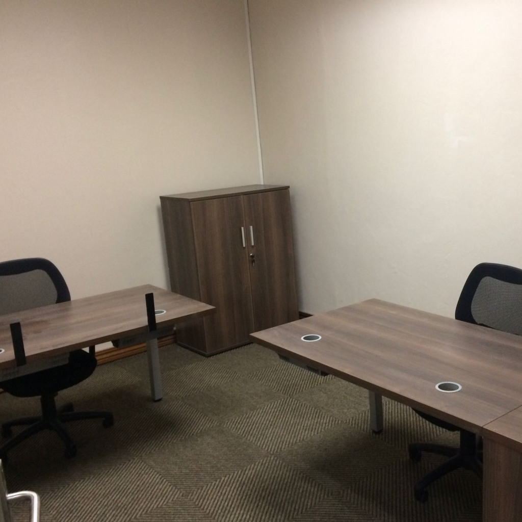 Modern 1-person serviced office suite in Midrand with professional furniture and natural light
